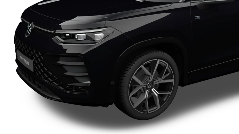 Volkswagen Tayron leasen - close-up van de koplamp en het lichtmetalen wiel