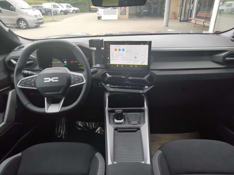 Full Operational Lease Dacia Bigster - dashboard met stuurwiel en infotainmentscherm