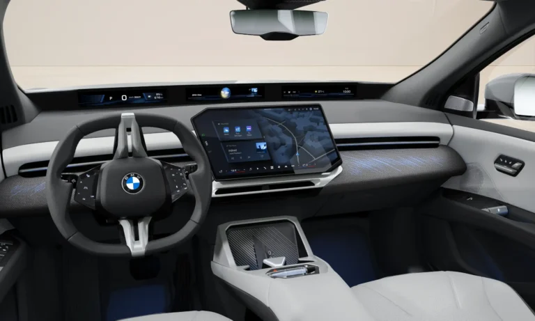 BMW iX3 zakelijk leasen - bestuurdersplaats met stuurwiel en gebogen curved display